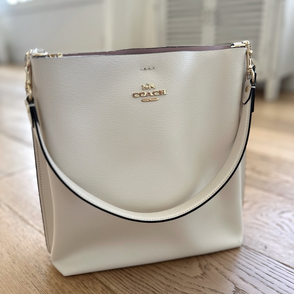 Coach Mollie bucket bag. Color: chalk, with wine/blush interior. New.